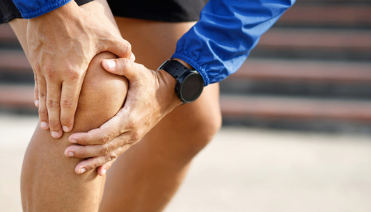 What is the ideal pressure setting (mmHg) in air compression boots for flushing out muscle soreness?